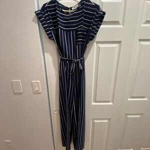 New. Never worn. Navy blue w/ white strips Jumpsuit with legs flares